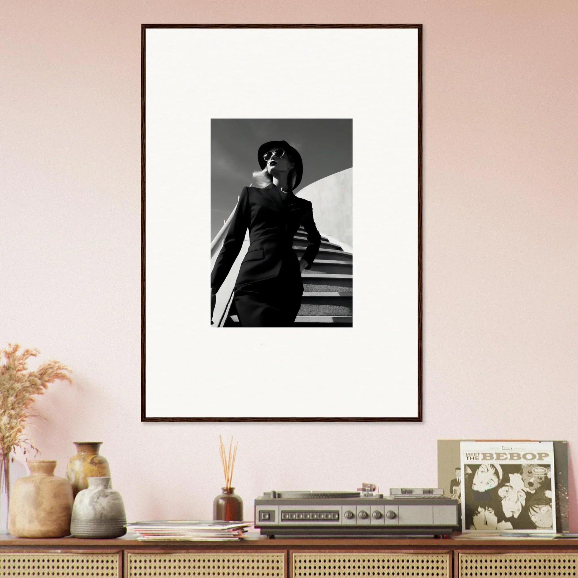 Framed black and white photograph of a person on stairs.