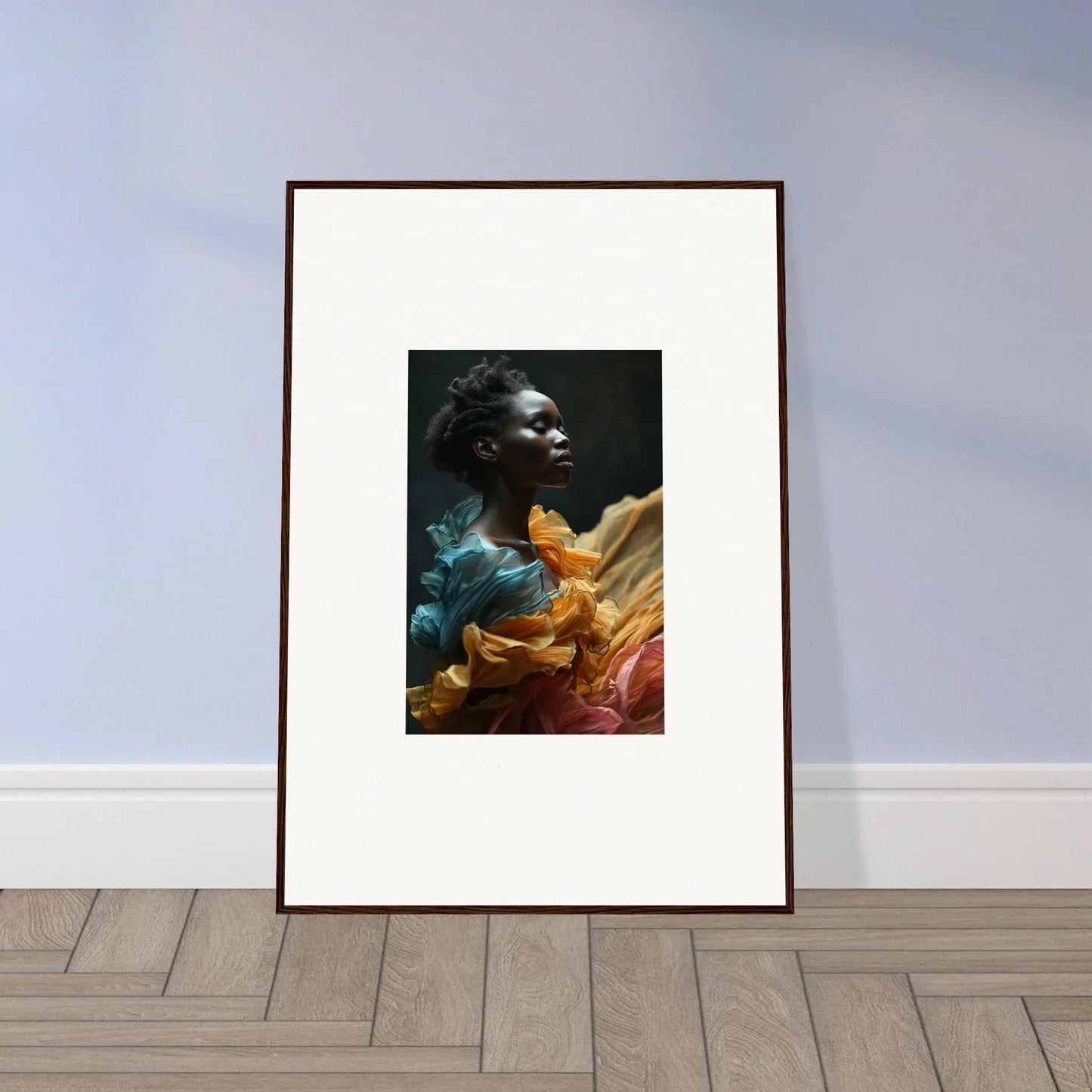 Framed portrait photograph of a person wearing colorful, flowing fabric.