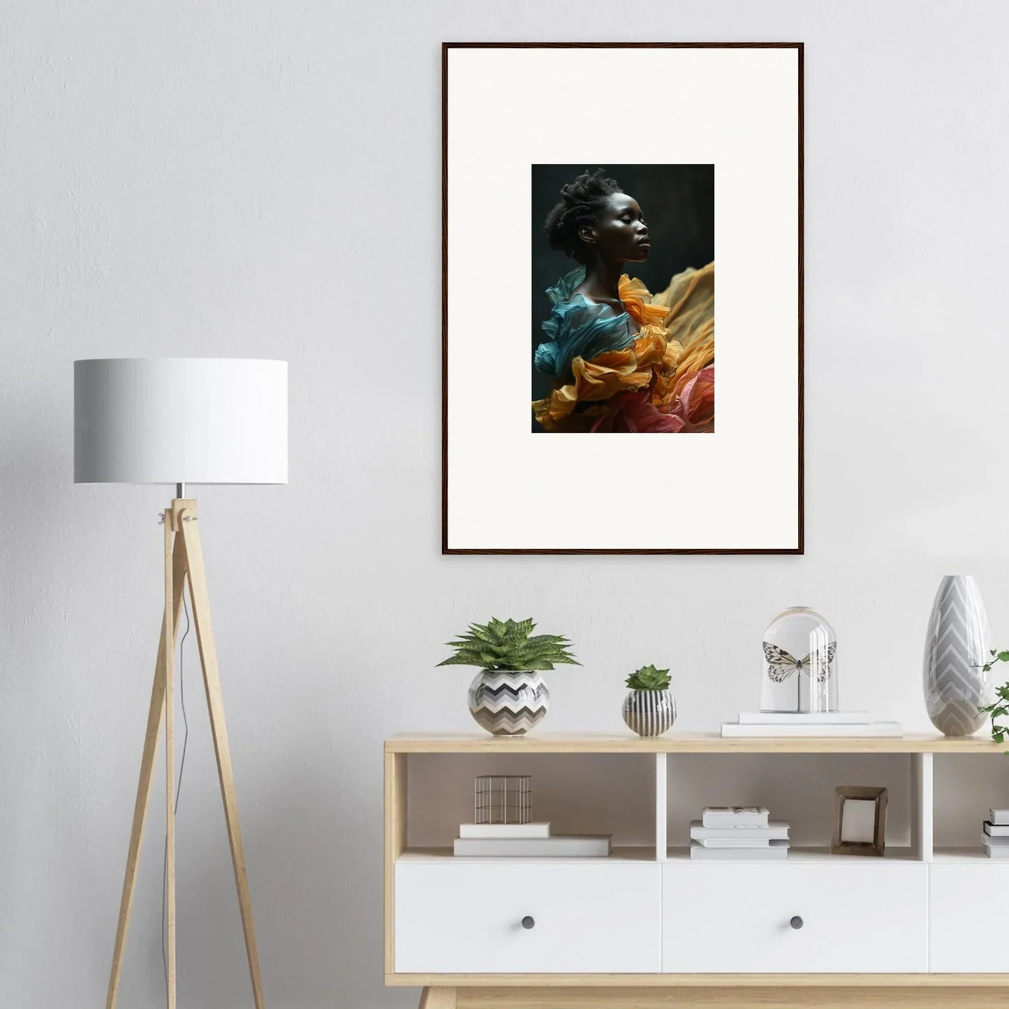 Framed portrait photograph of a person surrounded by colorful fabric or material.