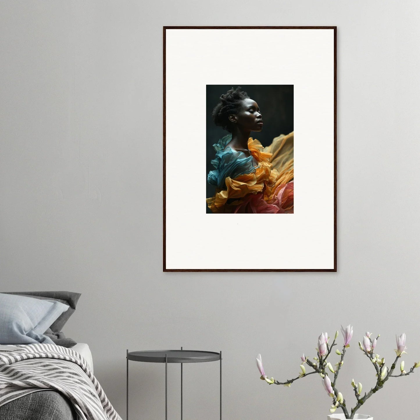 Framed portrait photograph of a person surrounded by colorful, ethereal-looking fabric or smoke effects.