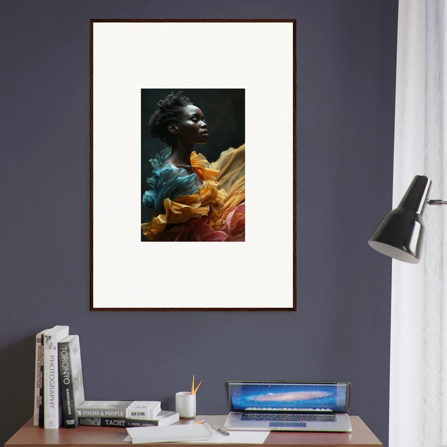 Framed portrait of a person surrounded by vibrant colors and abstract elements.