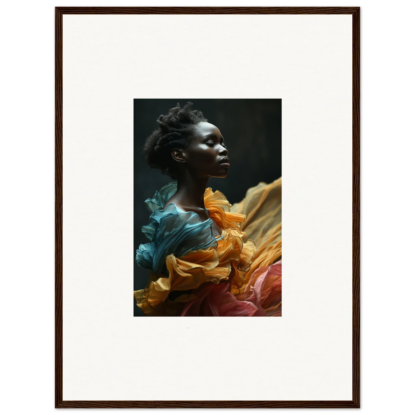 Portrait of a person surrounded by vibrant, flowing fabric in teal, orange, and burgundy hues.