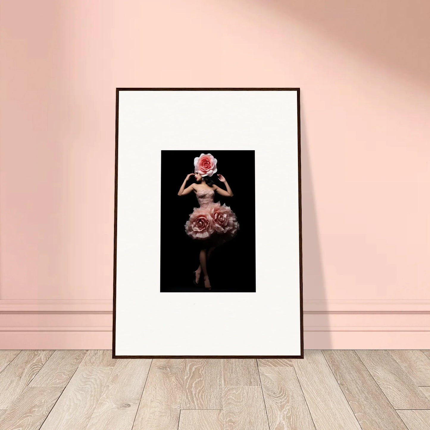 Framed artwork depicting a figure with a floral-themed dress and headpiece against a dark background.