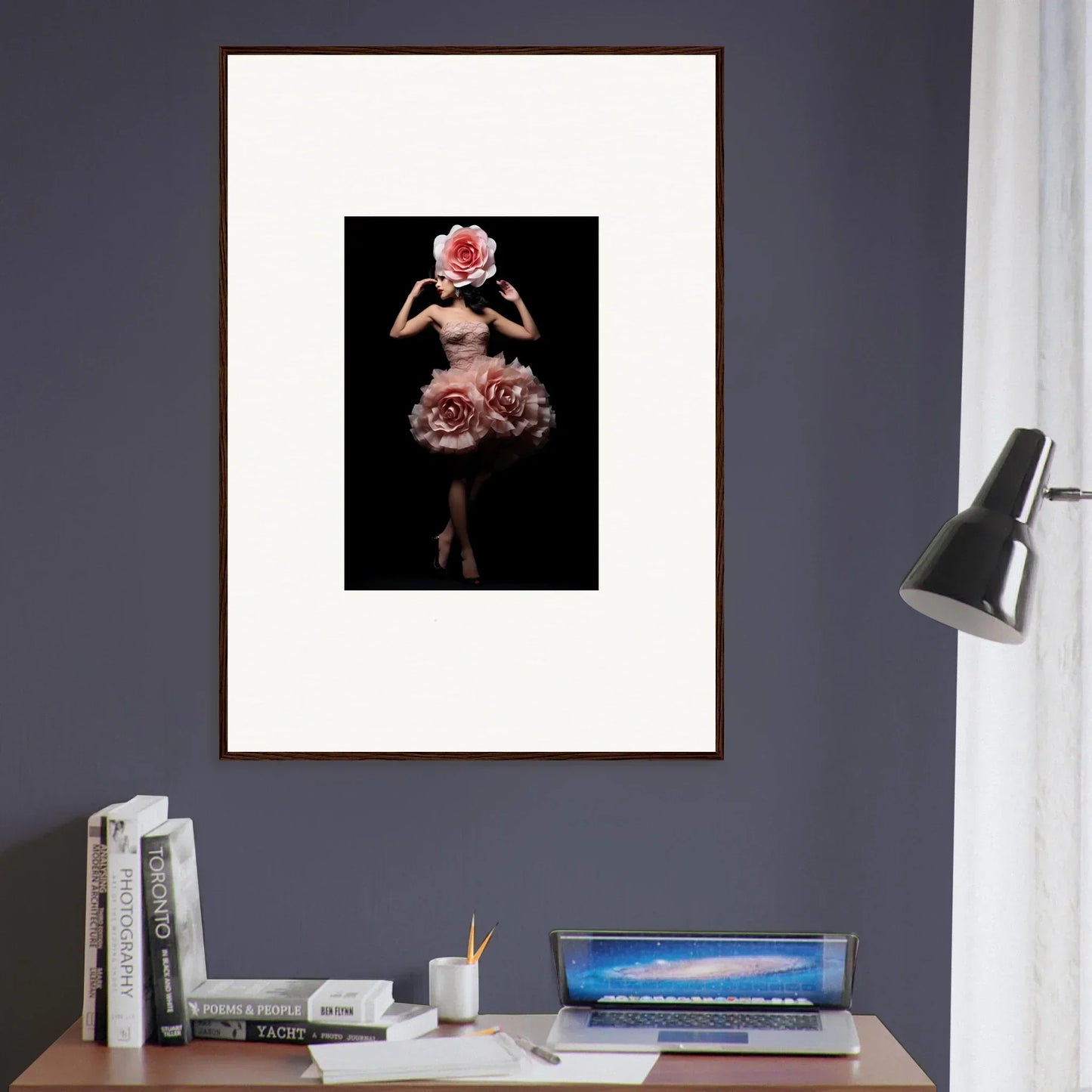Framed artwork depicting a figure in a floral dress against a dark background.