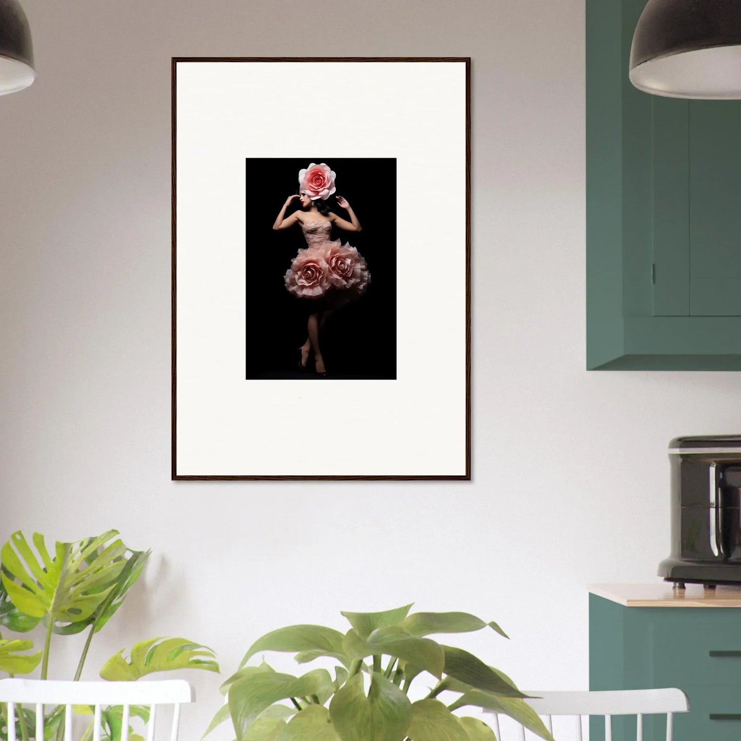 Framed artwork depicting a figure in a floral-inspired dress against a dark background.