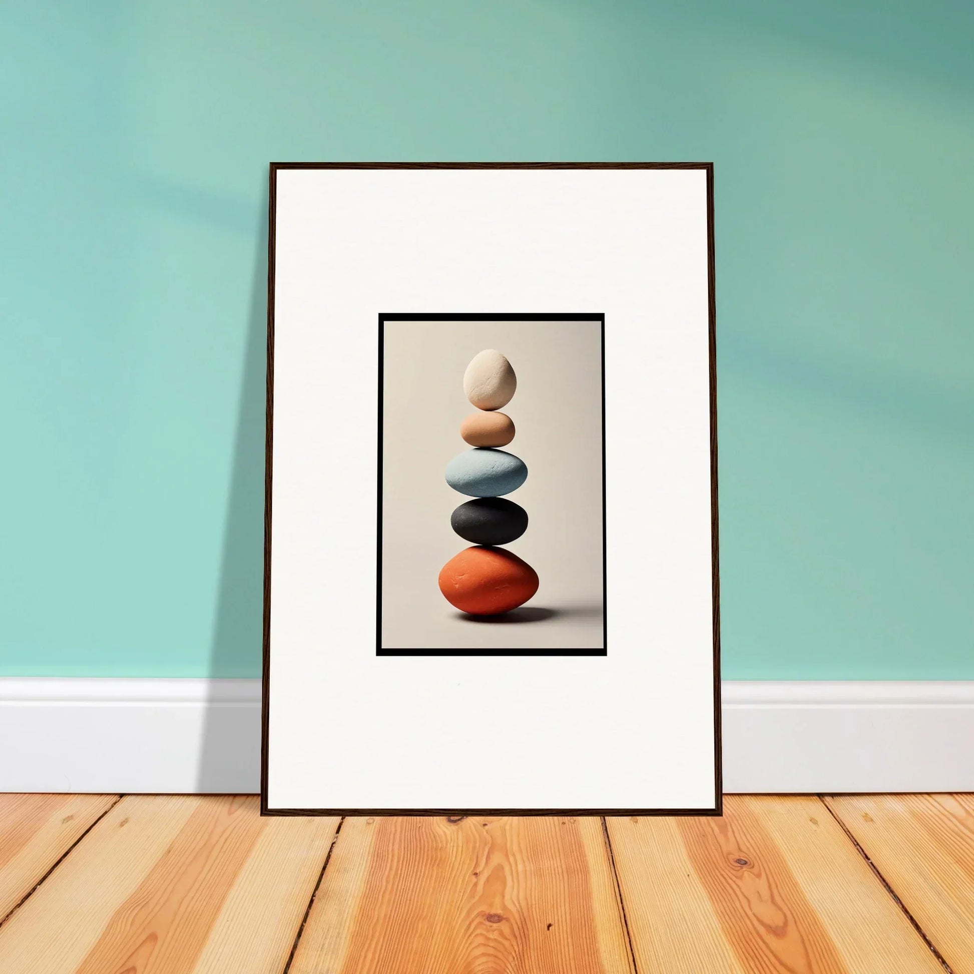 Framed wall art featuring balanced colorful stones, perfect for stylish room decor