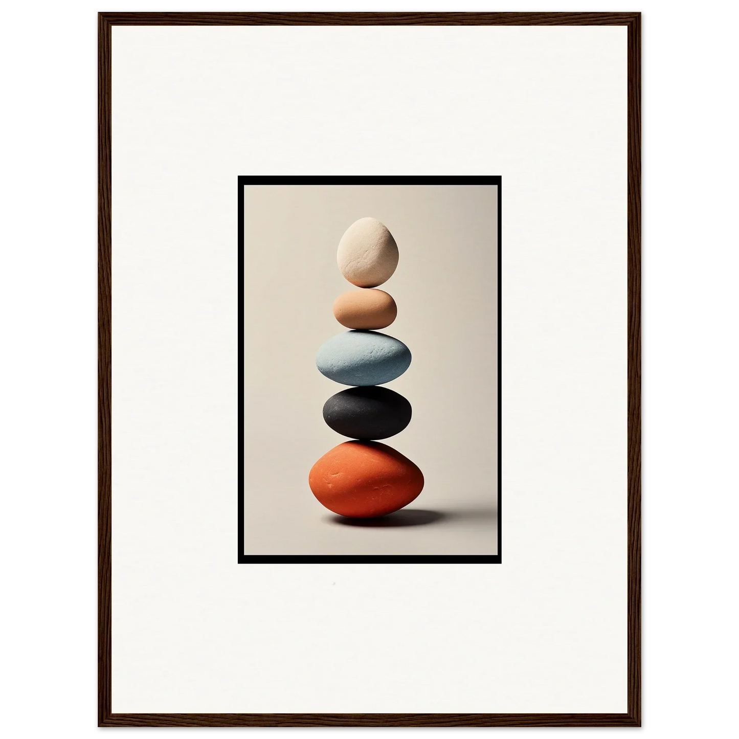 Balanced colorful stones stack showcasing unique room decor in a framed wall art design