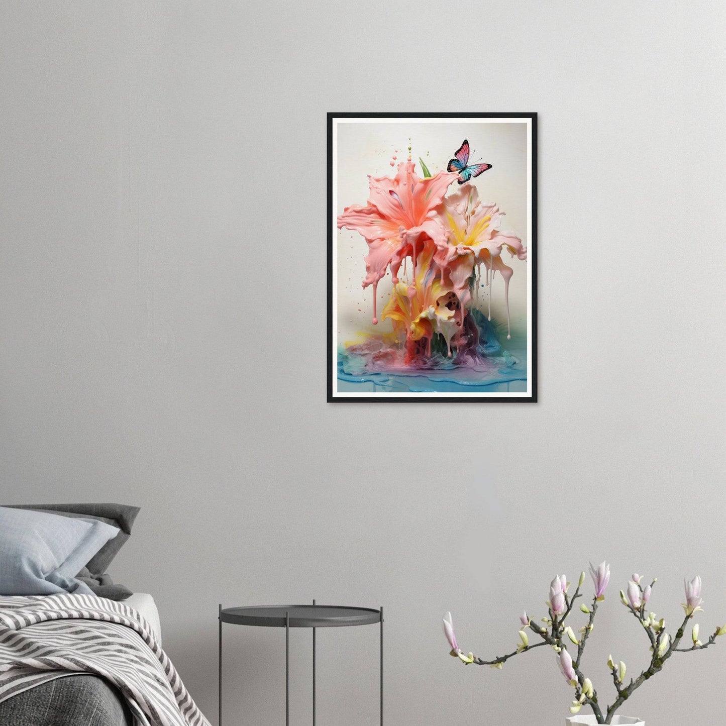 A framed print of a pink flower on a wall