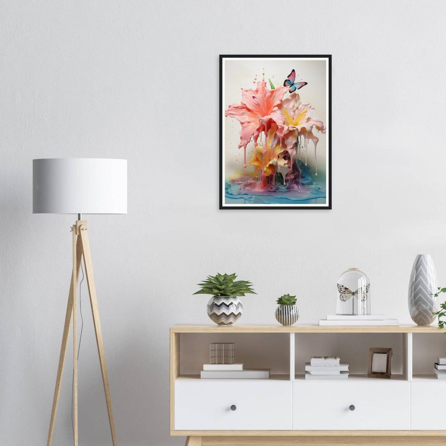 A framed print of a pink flower with a butterfly on it