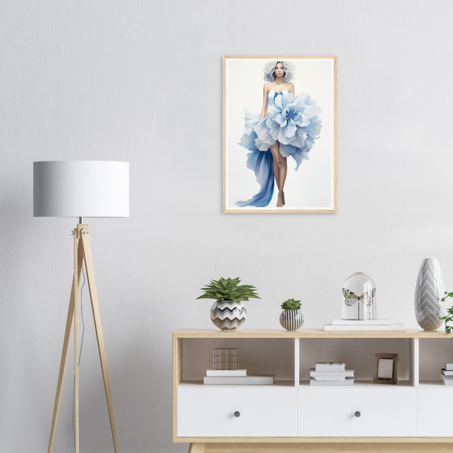 A framed print of a woman in a blue dress