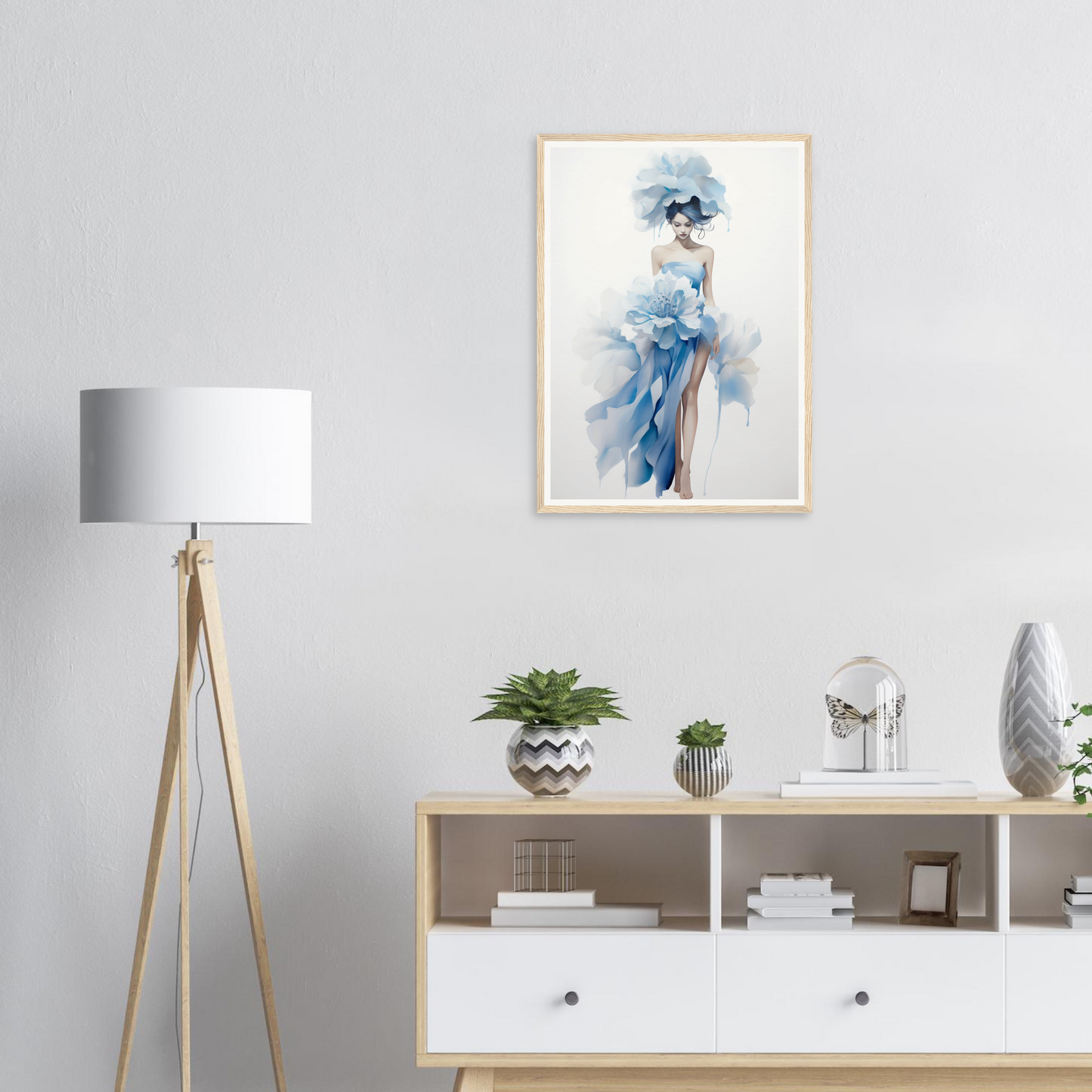 A framed print of a woman in a blue dress
