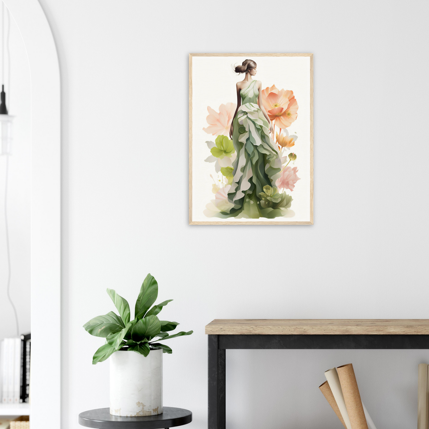 A framed print of a woman in a green dress with flowers
