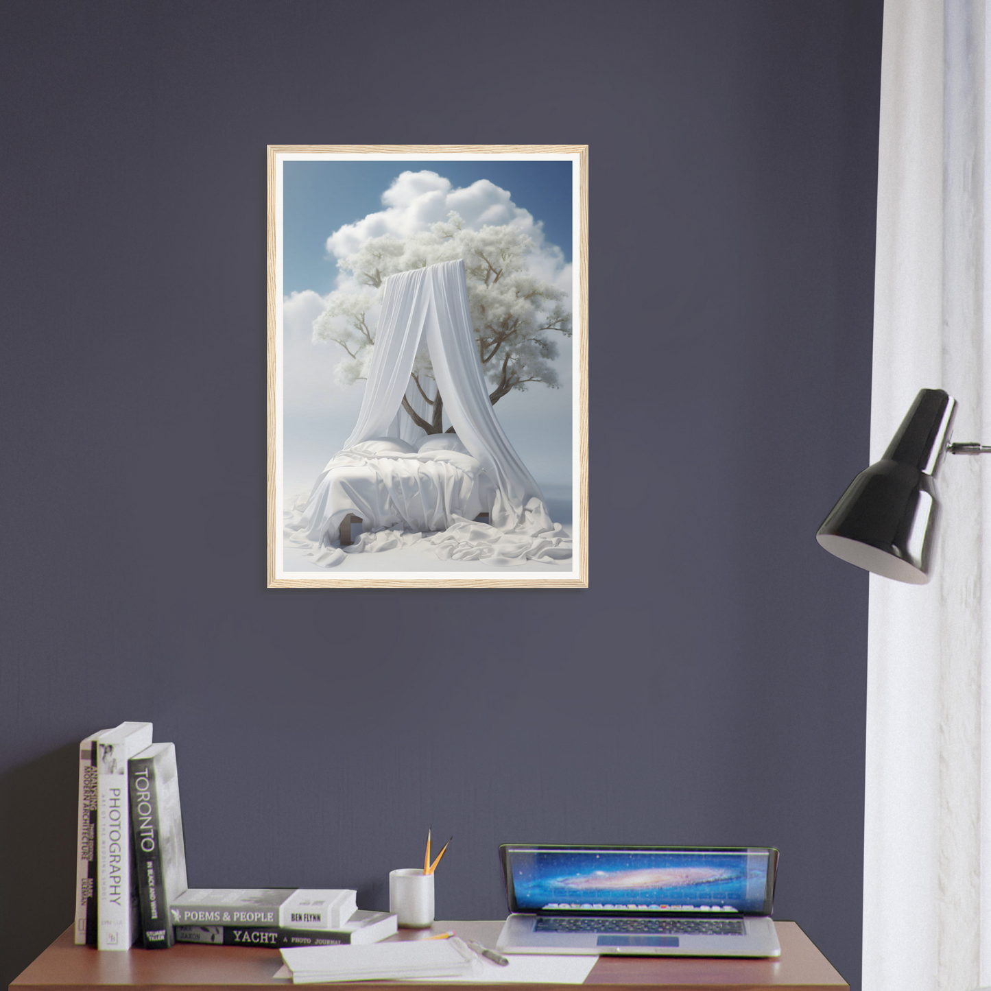 A framed print of a woman in a white dress sitting on a desk