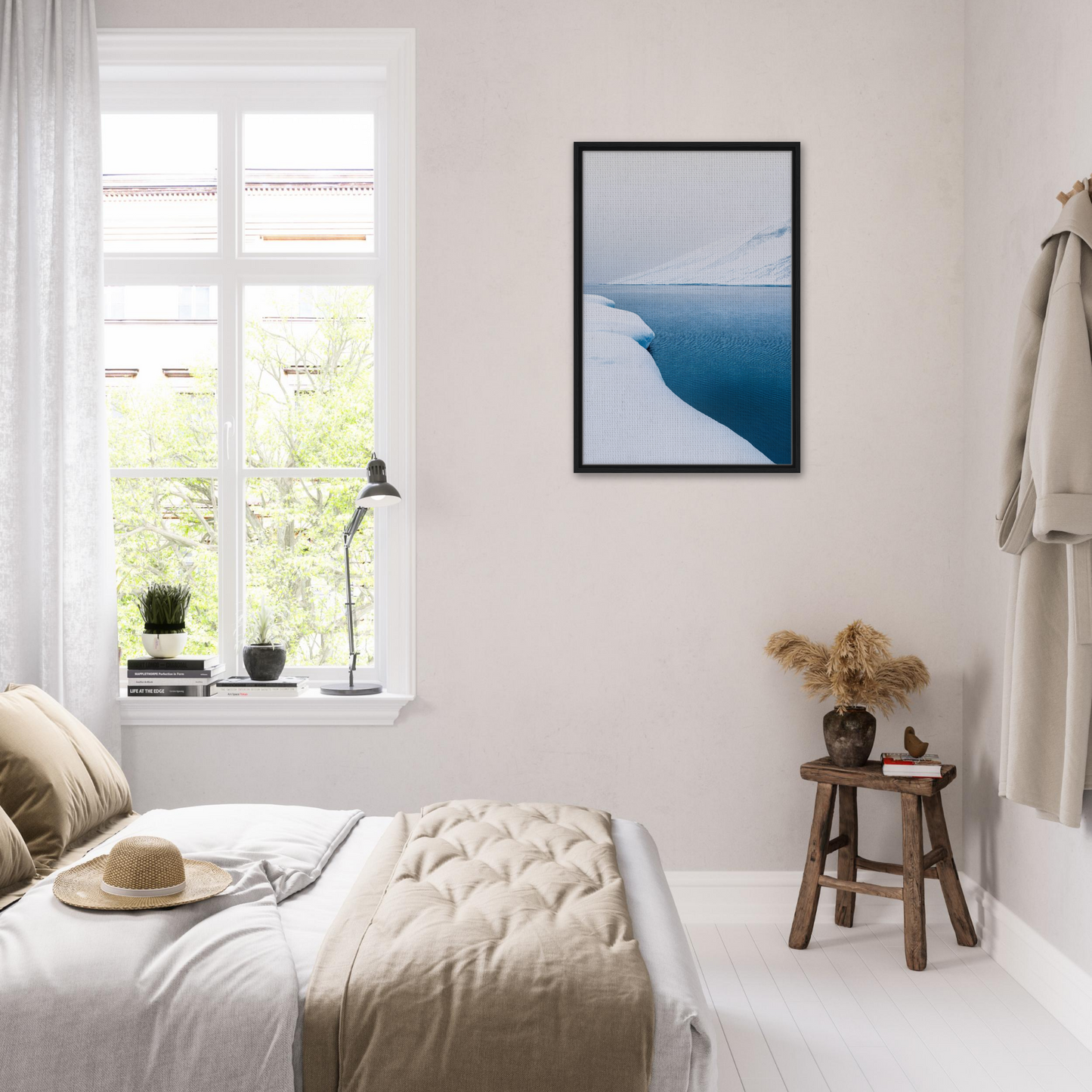 Bright, airy bedroom featuring Frozen Serenity Echoes framed canvas print with coastal decor
