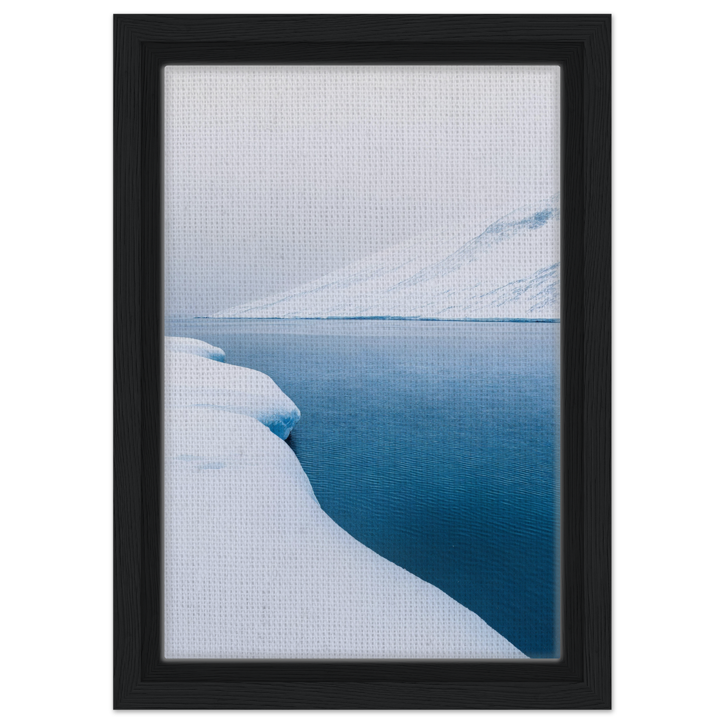 Framed canvas print of Frozen Serenity Echoes featuring a snowy landscape and blue water
