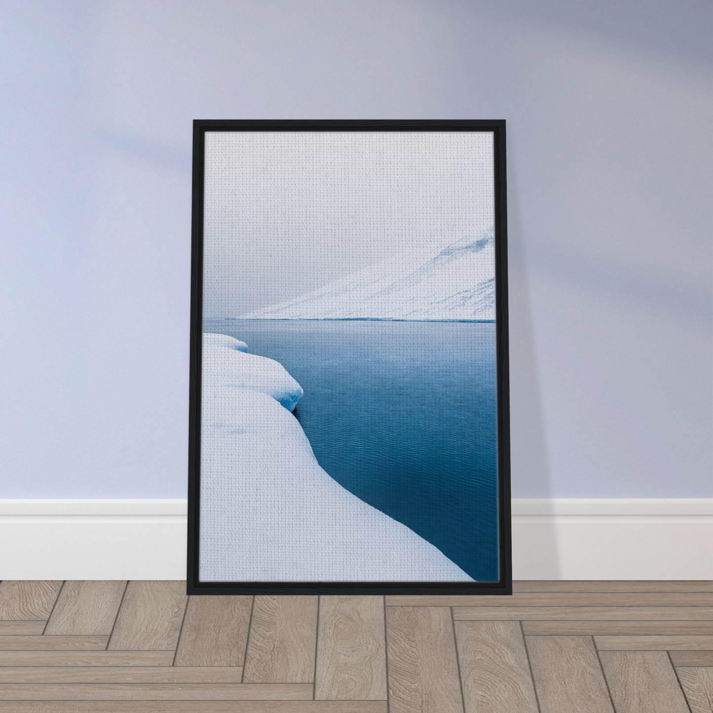 Framed photograph of a snowy landscape and calm blue water for Frozen Serenity Echoes room decor