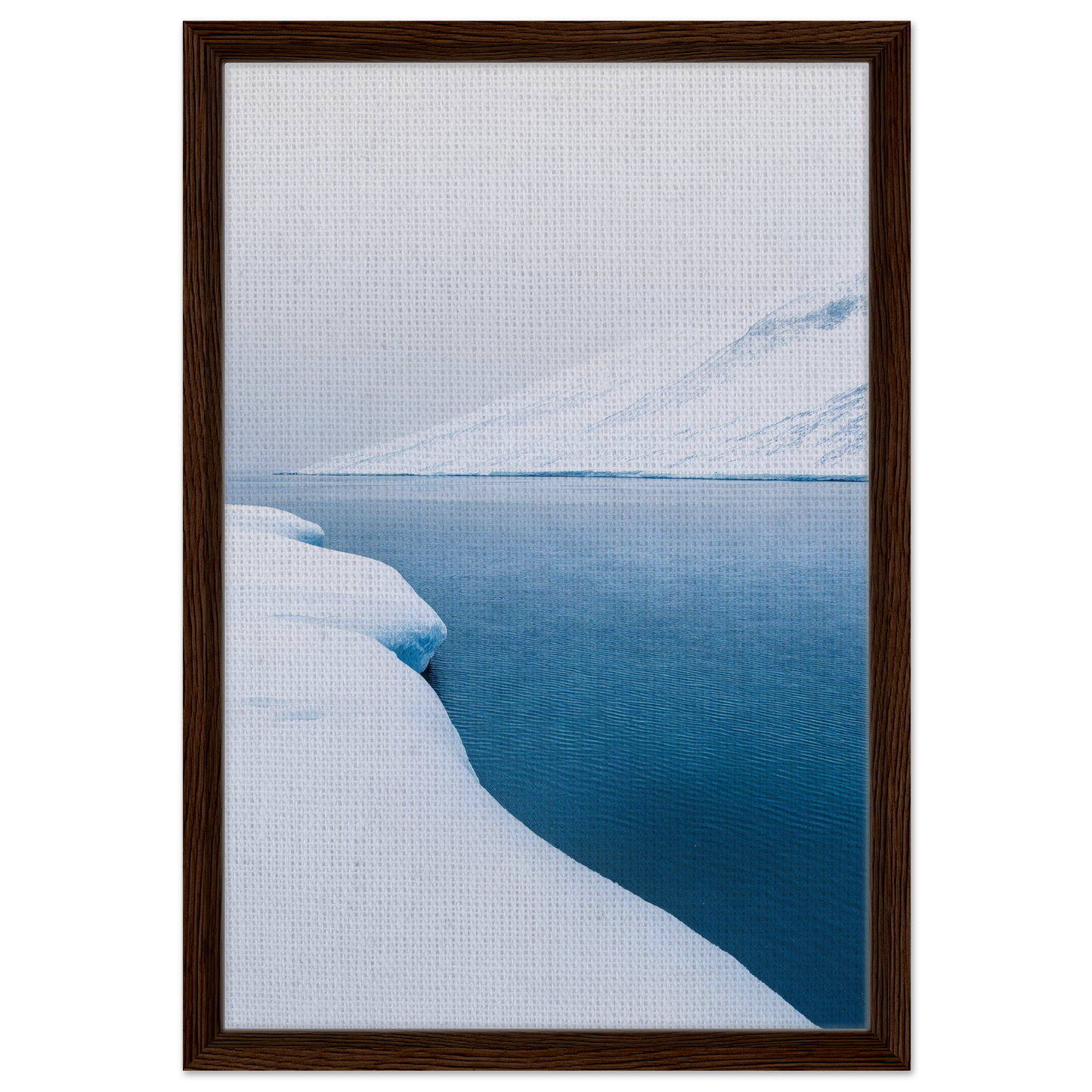 Framed photograph of snowy shoreline and calm water for Frozen Serenity Echoes