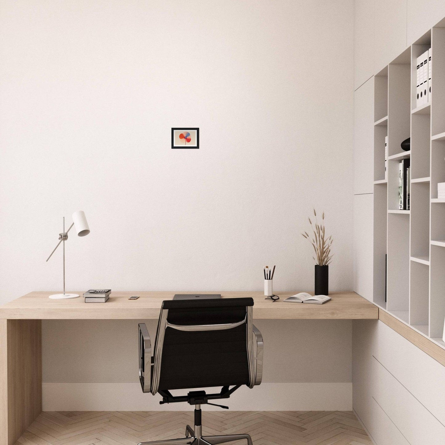 Minimalist wooden desk with a black office chair in a clean, white workspace.