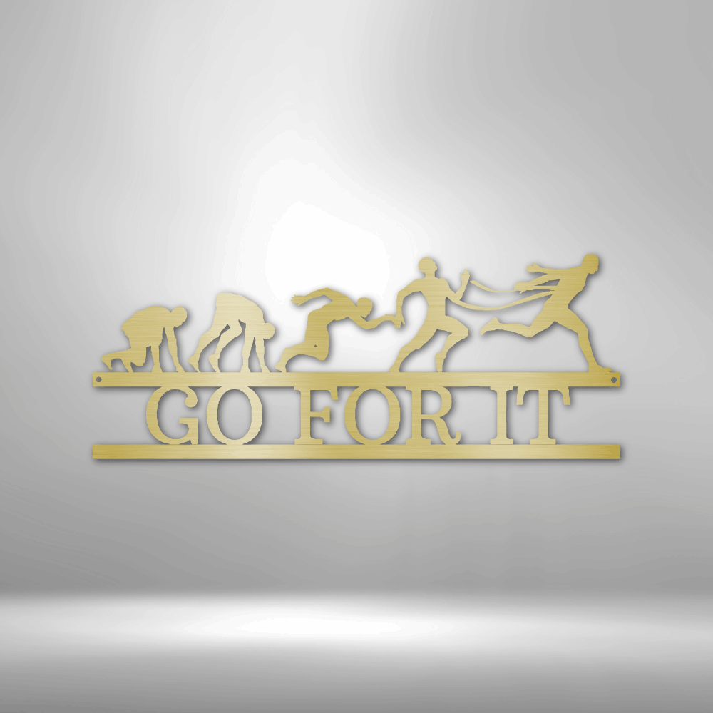 Yellow metal or wooden cutout displaying silhouettes of runners in motion with the text ’GO FOR IT’ underneath.