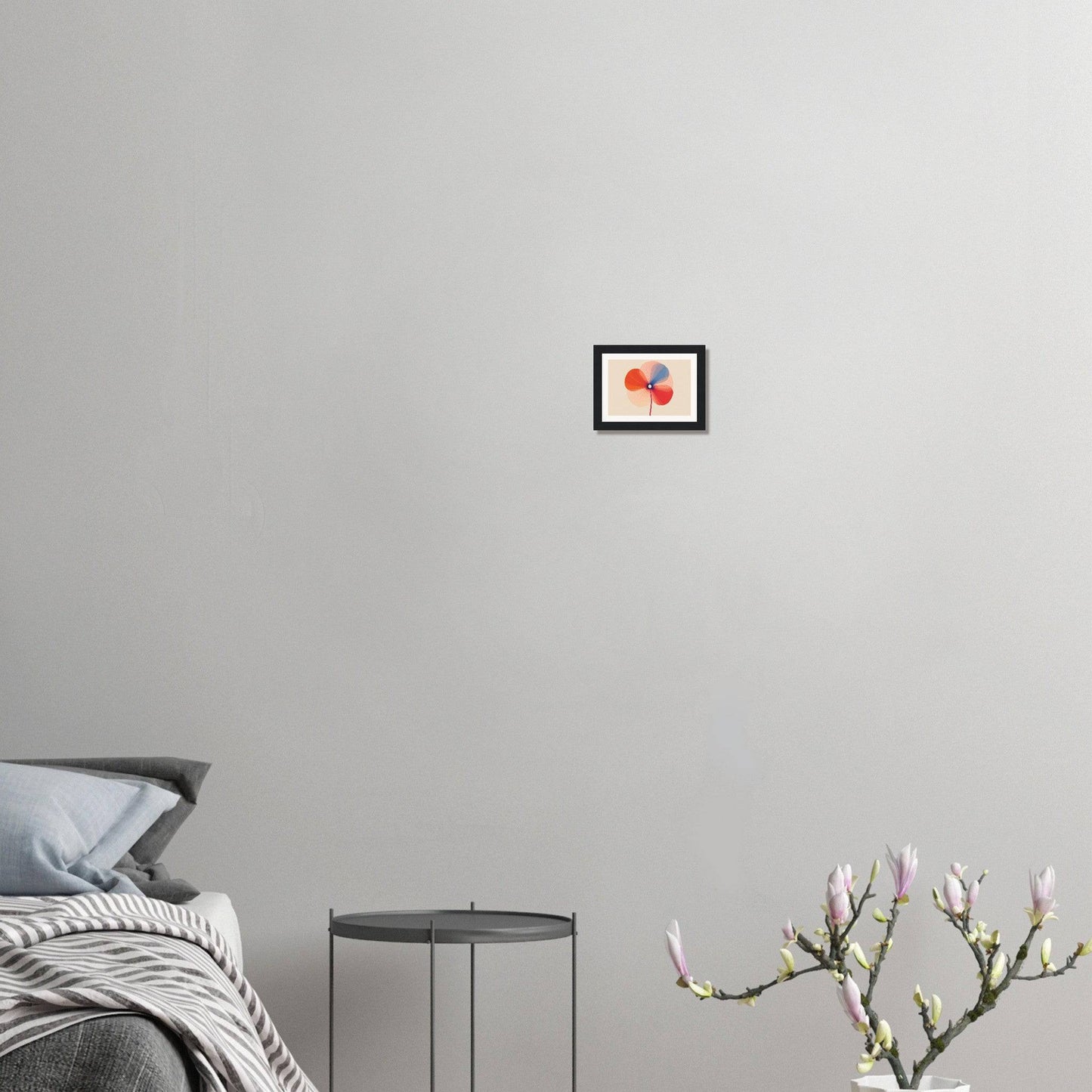 Framed artwork of red cherries hanging on a light gray wall.