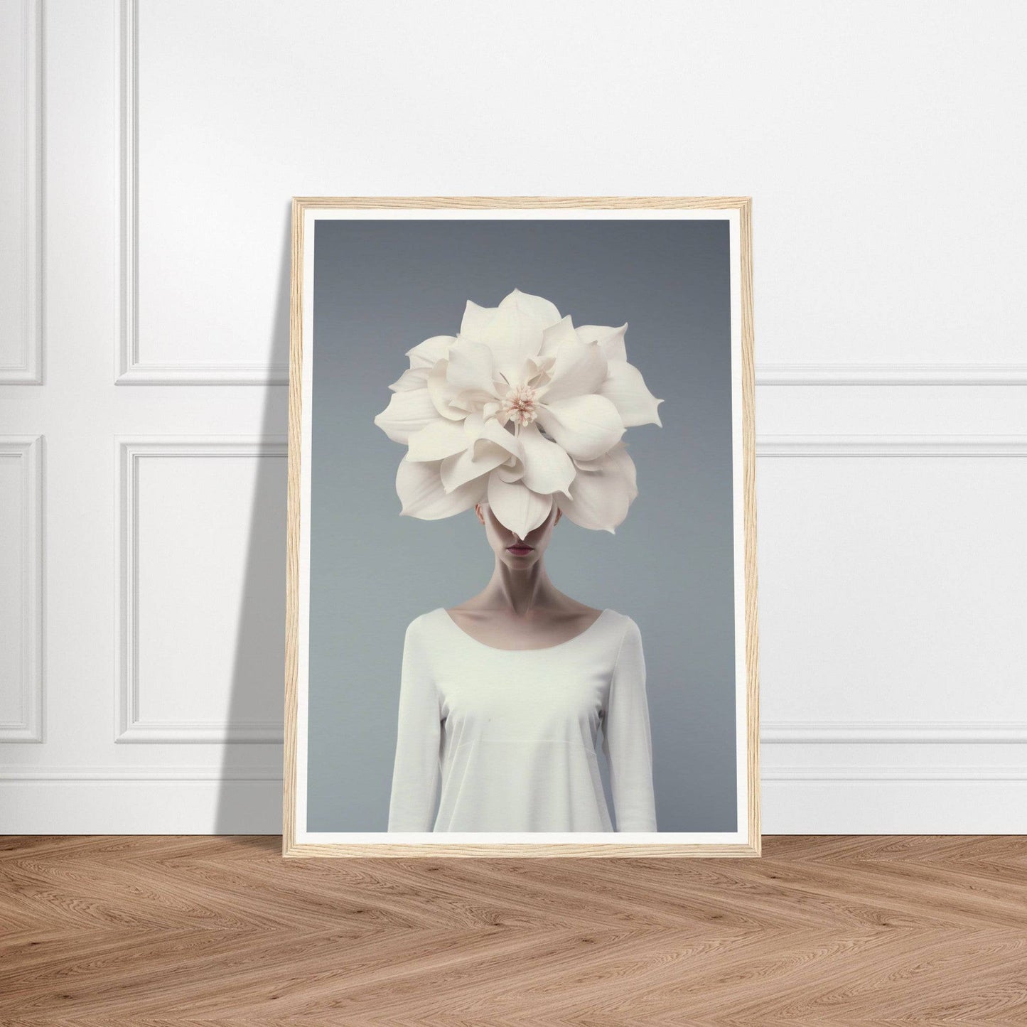 Framed artwork depicting a figure wearing an oversized white flower as a head.