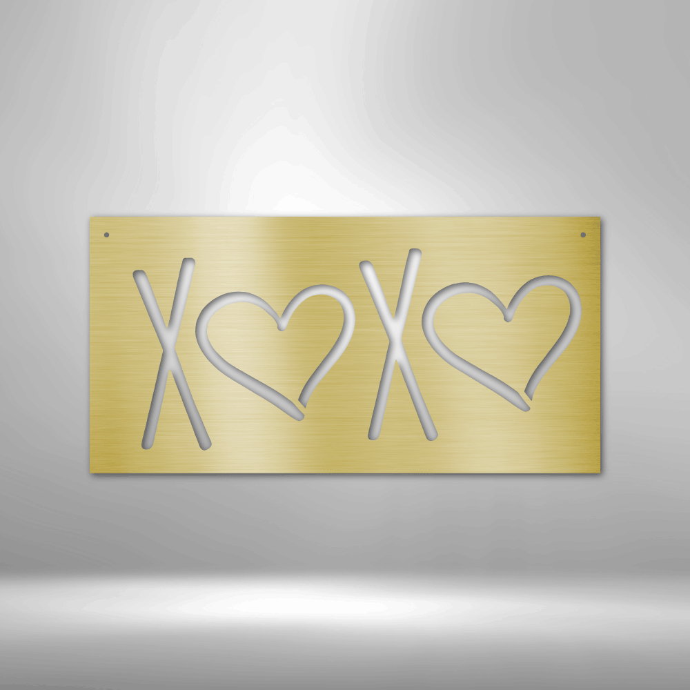 Gold-colored metal plate with ’XOXO’ cut out in a stylized design featuring hearts.