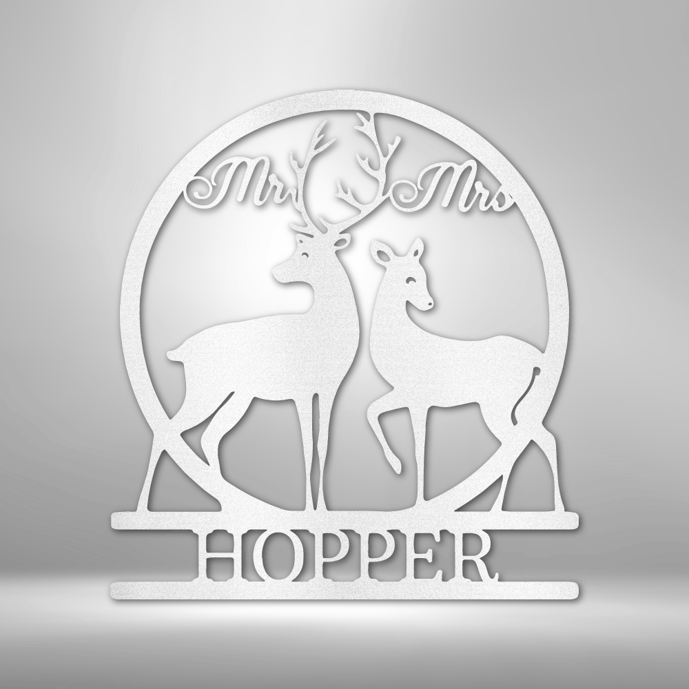 Decorative white silhouette featuring two deer and the text ’Mr & Mrs HOPPER’ in a circular frame.