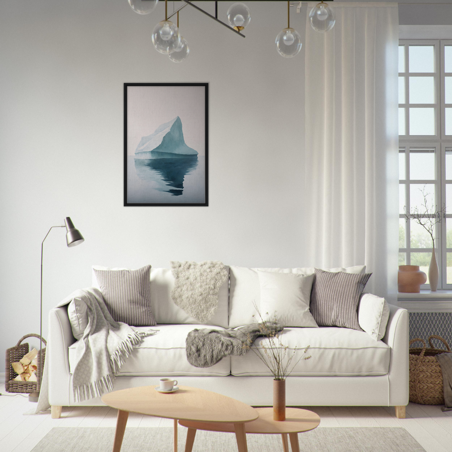 White sofa adorned with throw pillows and blankets from Iceberg Epiphanies collection