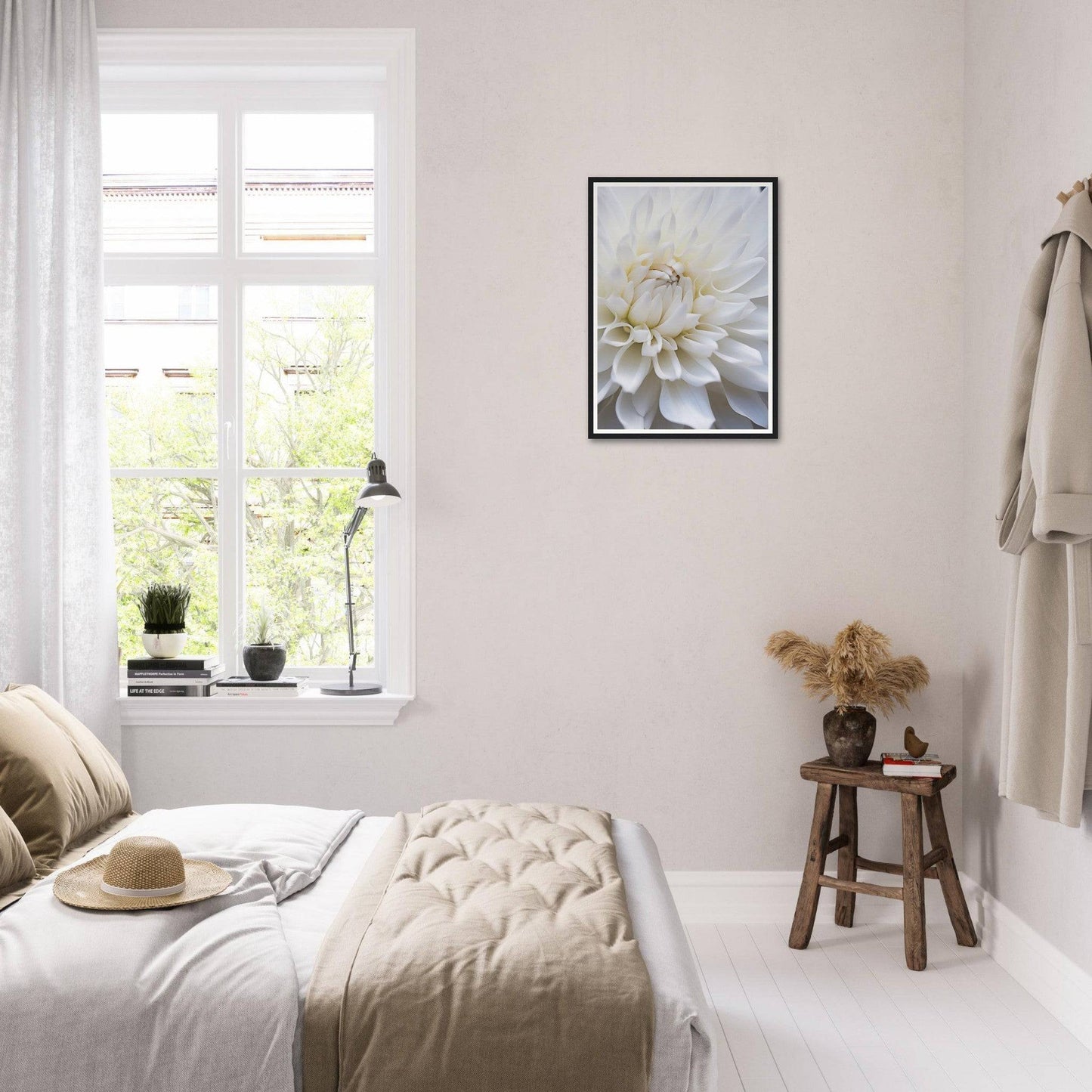 Bright, airy bedroom with minimalist decor and neutral color palette.