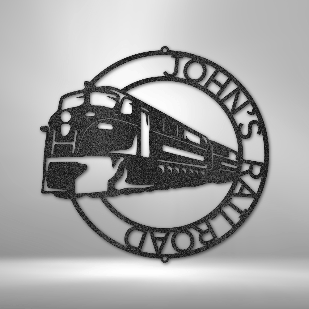 Circular metal wall art featuring a stylized train design and the text ’JOHN’S RAILROAD’.