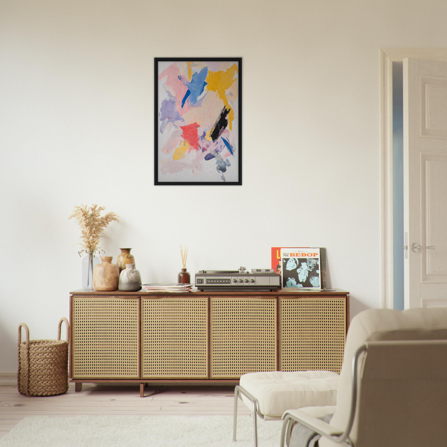 Wooden sideboard with cane-webbed doors and decor atop in Joy’s Chromatic Fugue