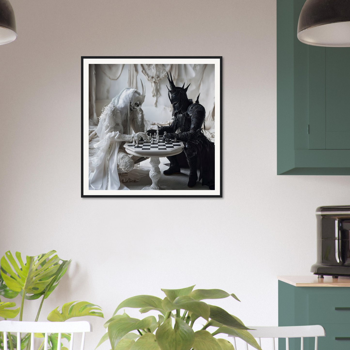 Framed black and white photo of two figures in costumes playing chess for Kindled Celestial Dance