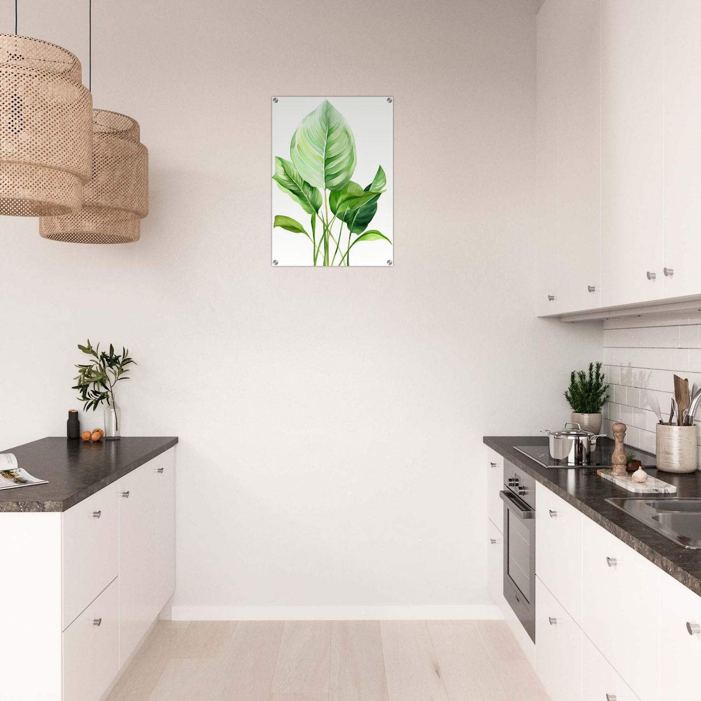 A kitchen with white cabinets and a green leaf print on the wall