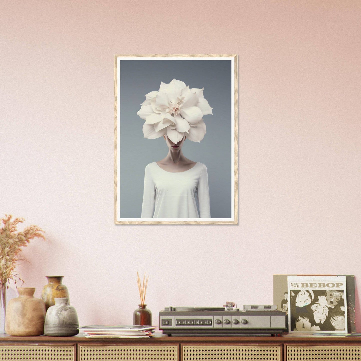 Framed surrealist portrait of a figure with a white flower for a head.
