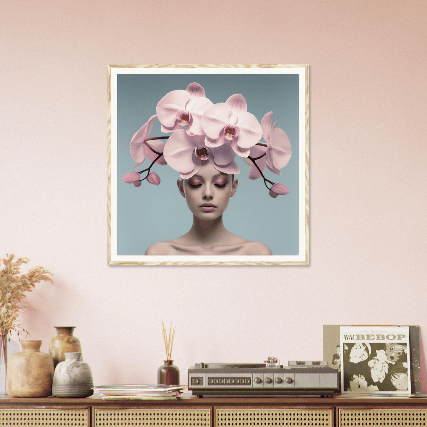 Framed artwork featuring a person wearing an elaborate orchid headdress.