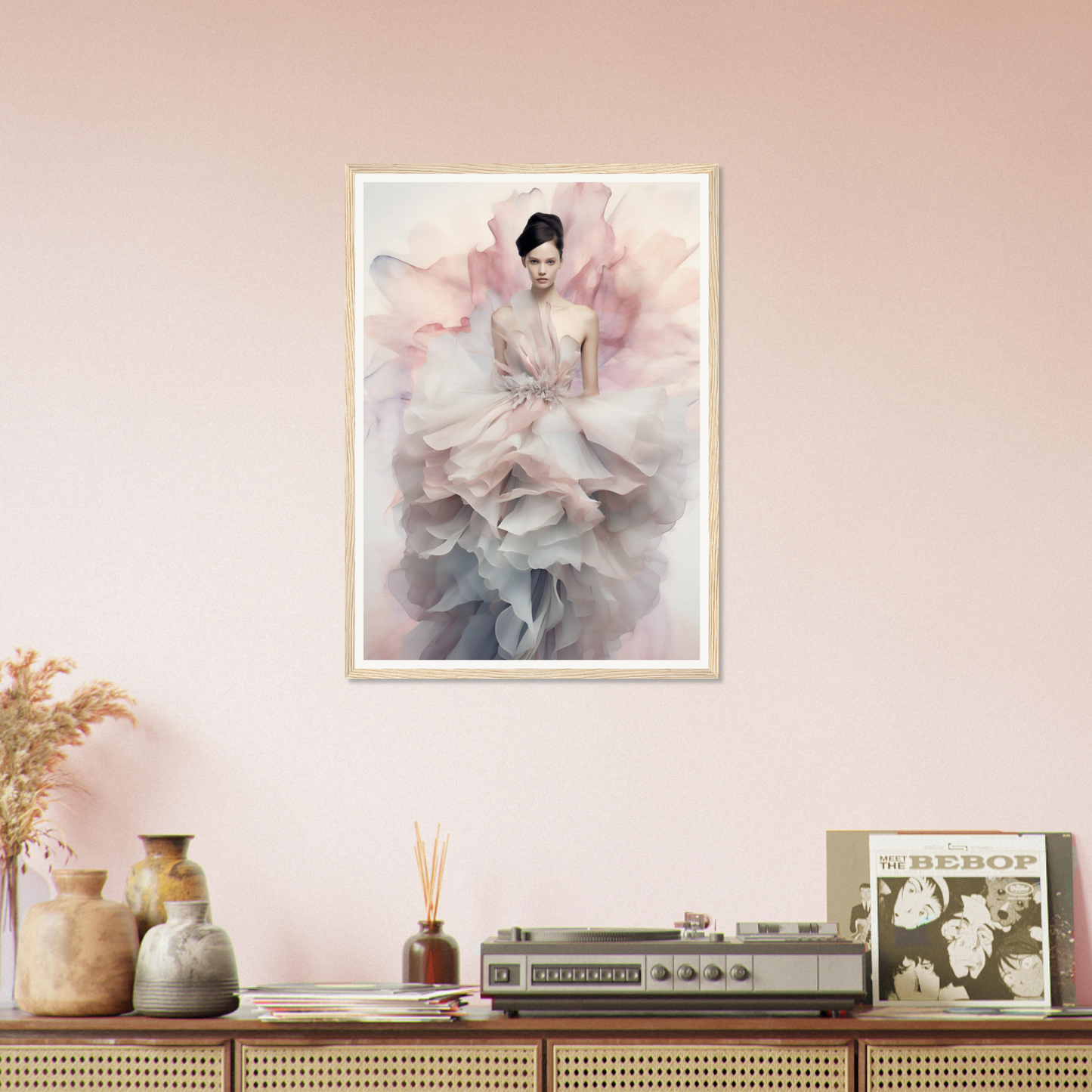 Framed artwork depicting a figure in a flowing, ethereal dress with soft pink and gray tones.