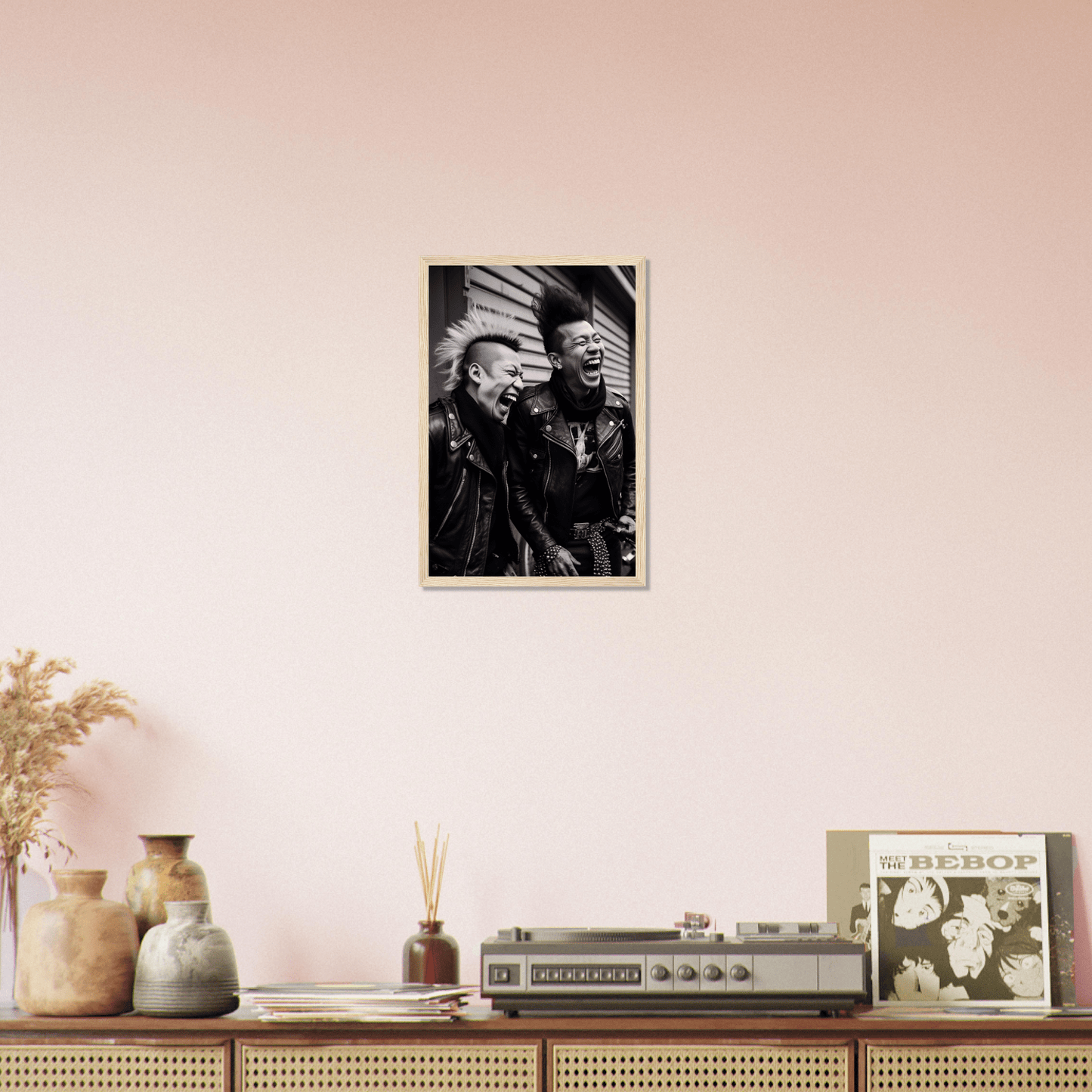 Framed black and white photograph of two people hanging on a wall.