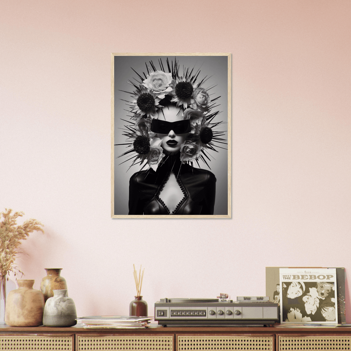 Striking black and white portrait of a figure wearing sunglasses and an elaborate spiked headdress.