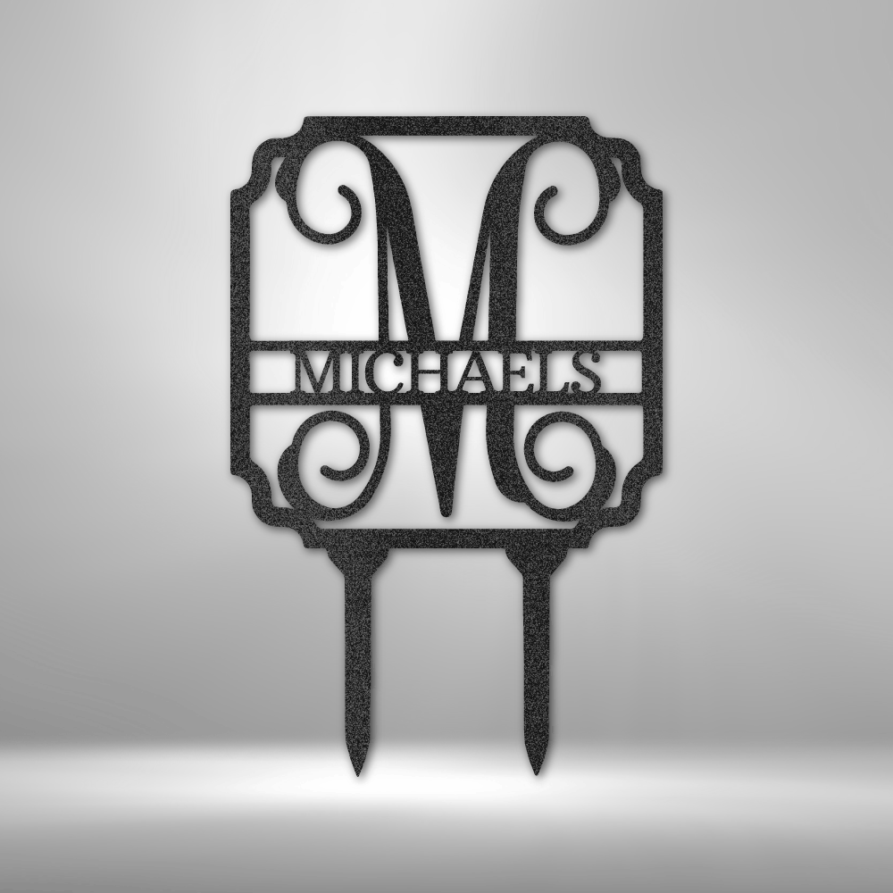 Decorative monogram cake topper with the name ’MICHAELS’ and ornate scrollwork.
