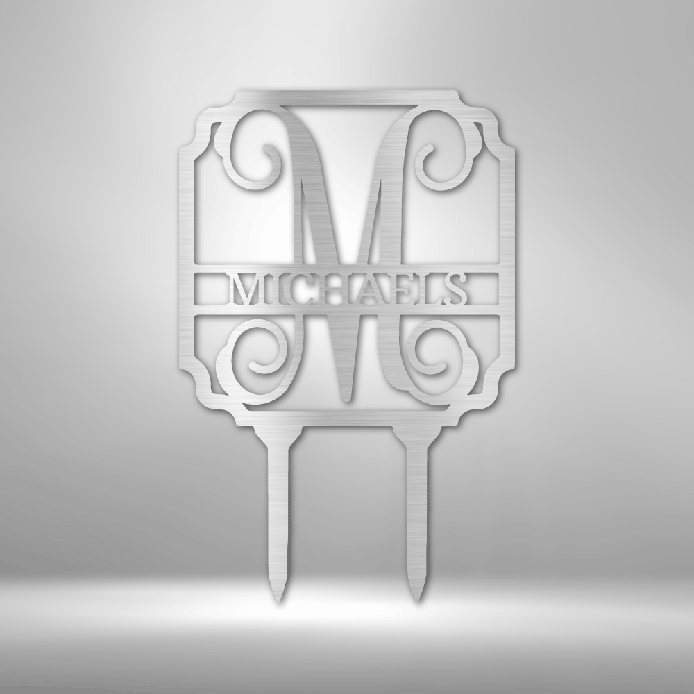 Decorative cake topper featuring the letter ’M’ and the name ’MICHAELS’ in an ornate design with scrollwork.