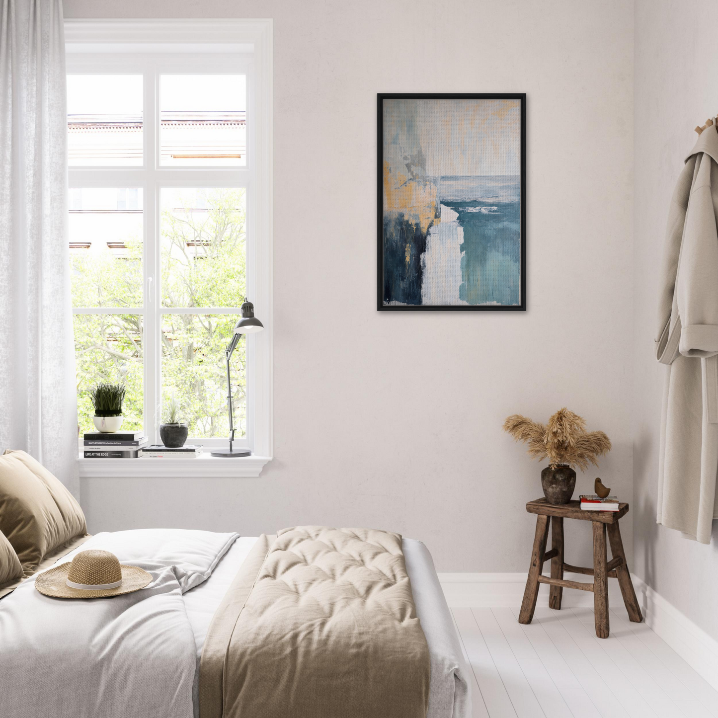 Bright, airy bedroom featuring Oceanic Ever Blue with a blue framed canvas art