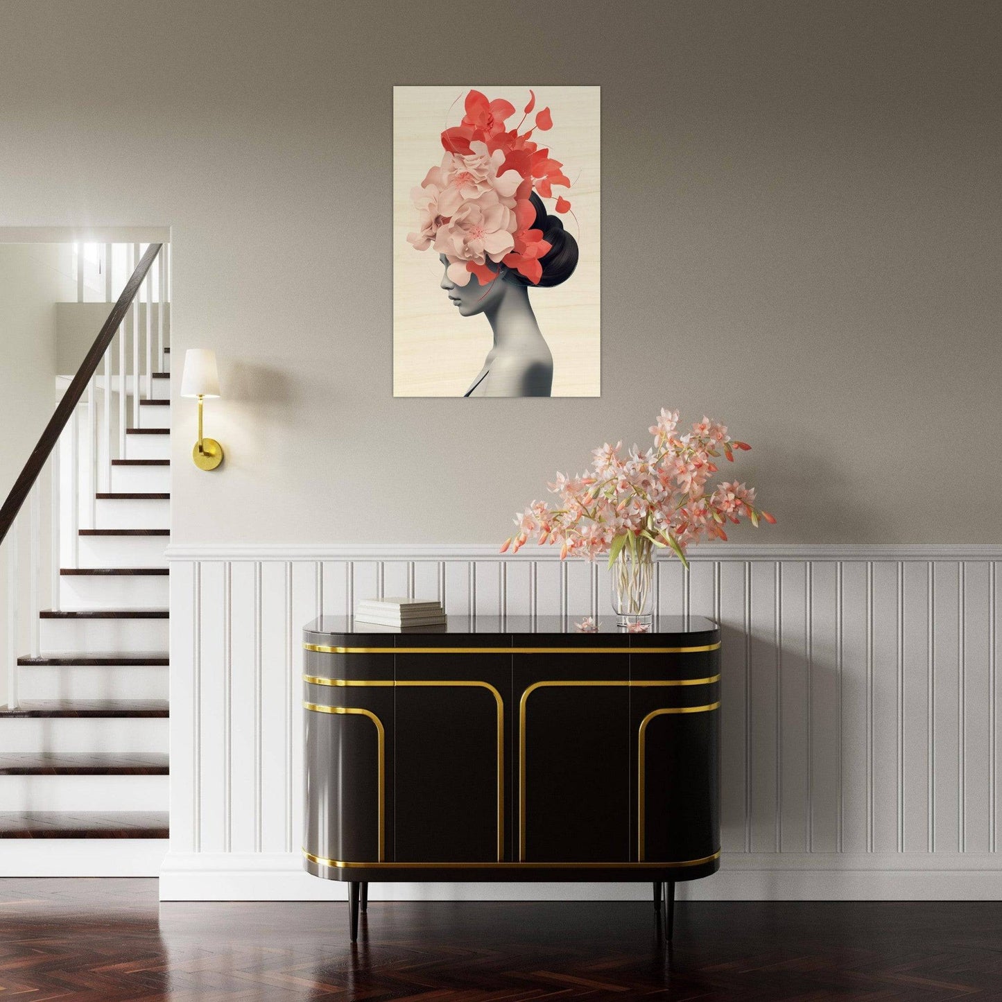 Elegant entryway console table with black and gold accents, topped with a floral arrangement and artwork.