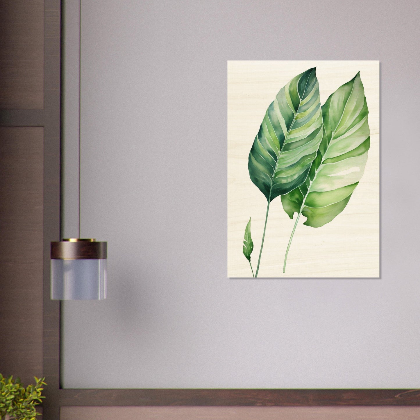 A painting of a green leaf on a wall