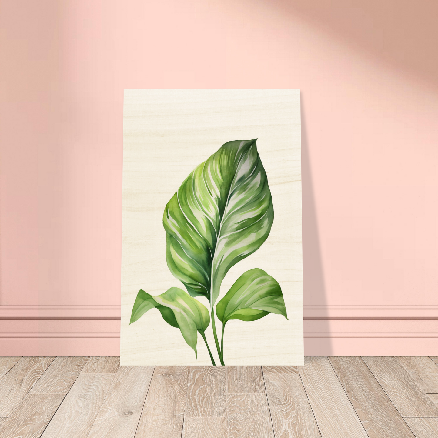 A painting of a green leaf on a wooden floor