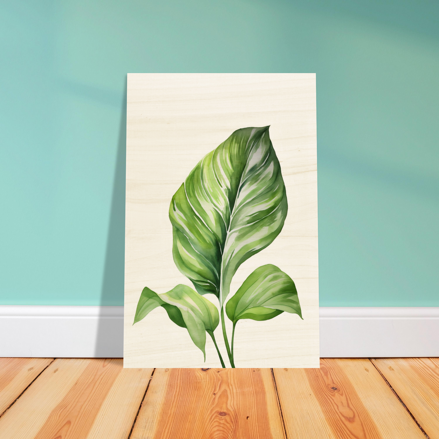 A painting of a green leaf on a wooden floor