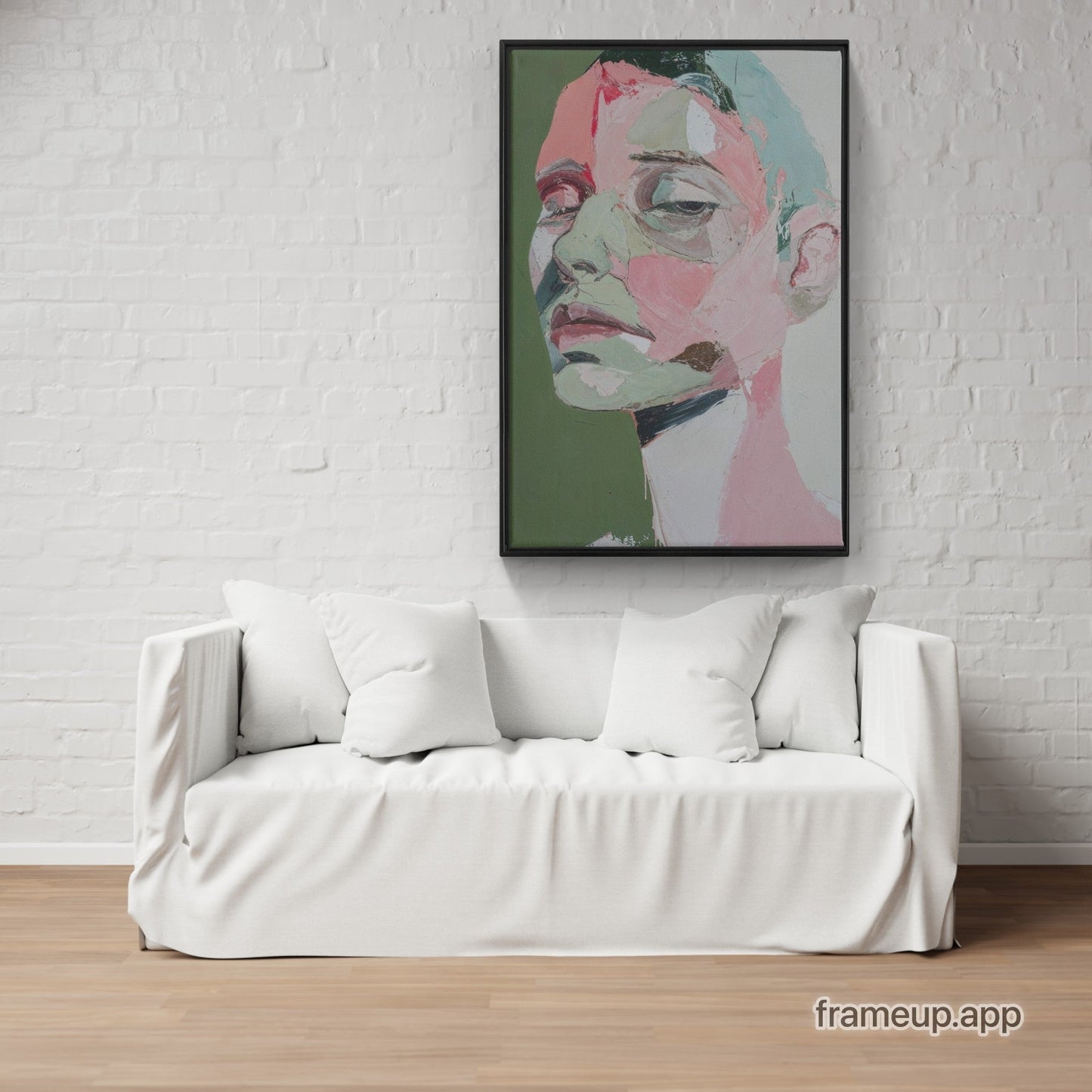 A painting on a wall above a white couch