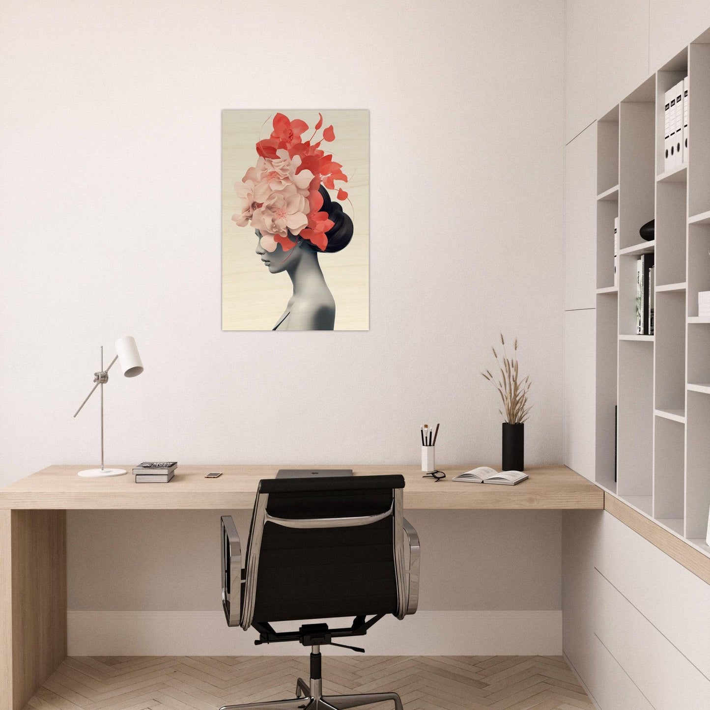 Minimalist home office workspace with a striking floral portrait on the wall.