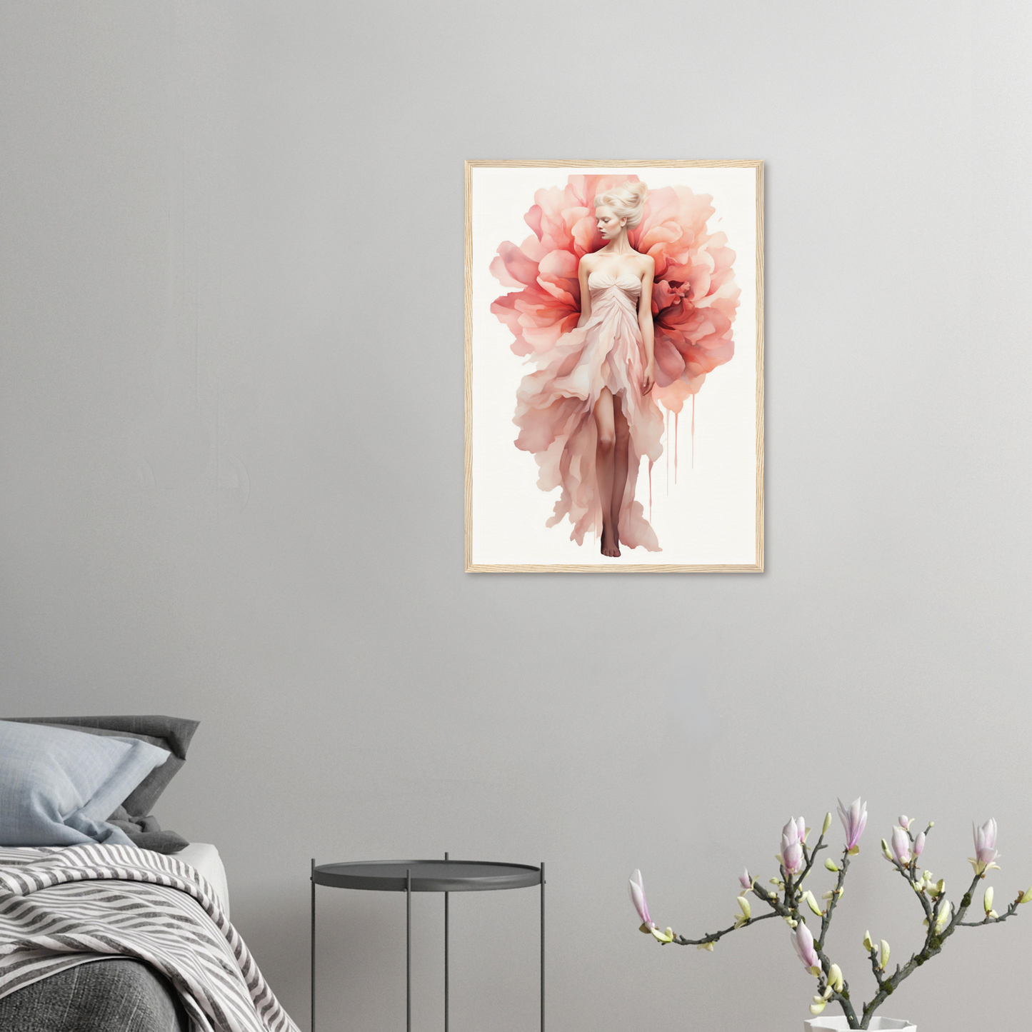 A pink flower in a white frame on a wall
