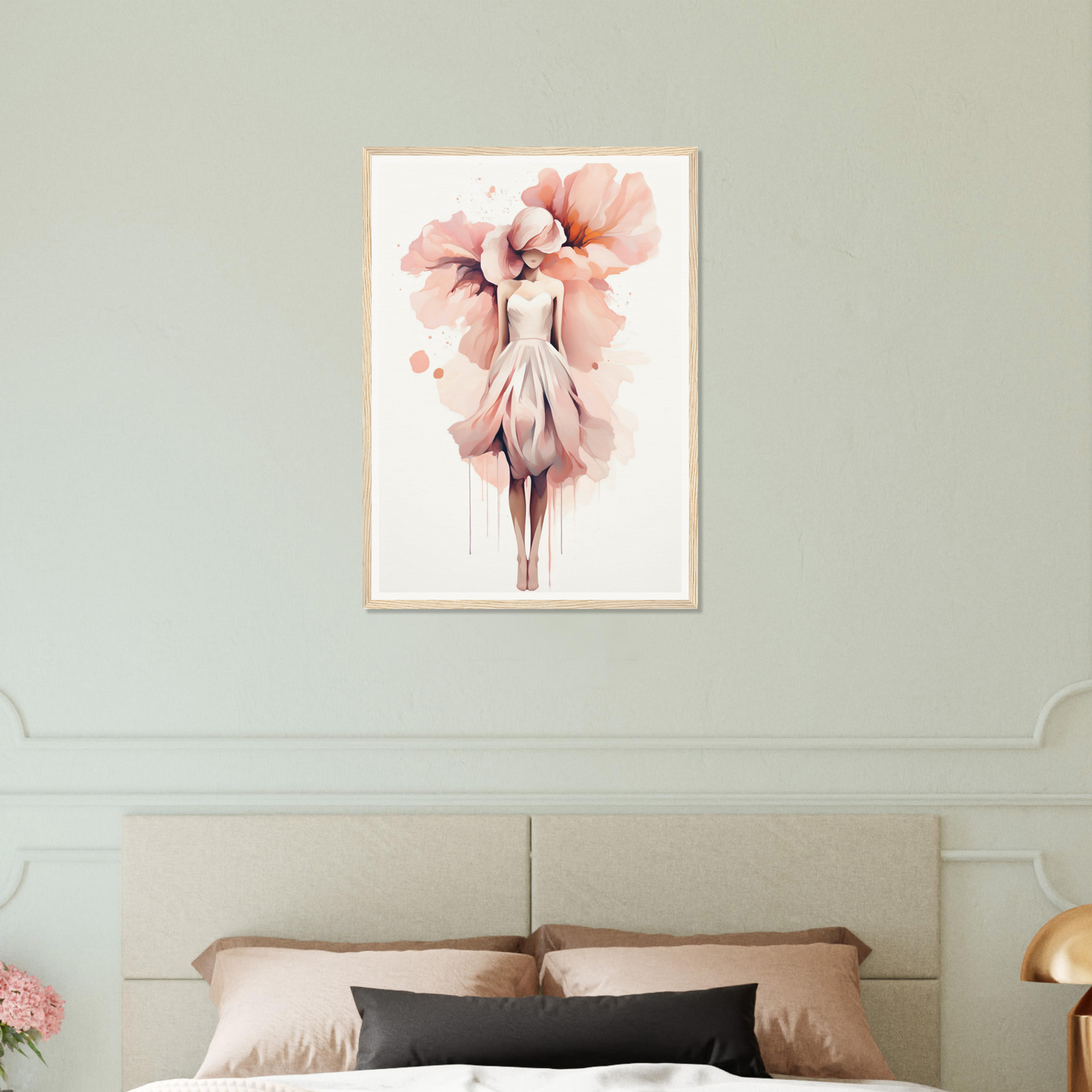 A pink flower on a white wall above a bed