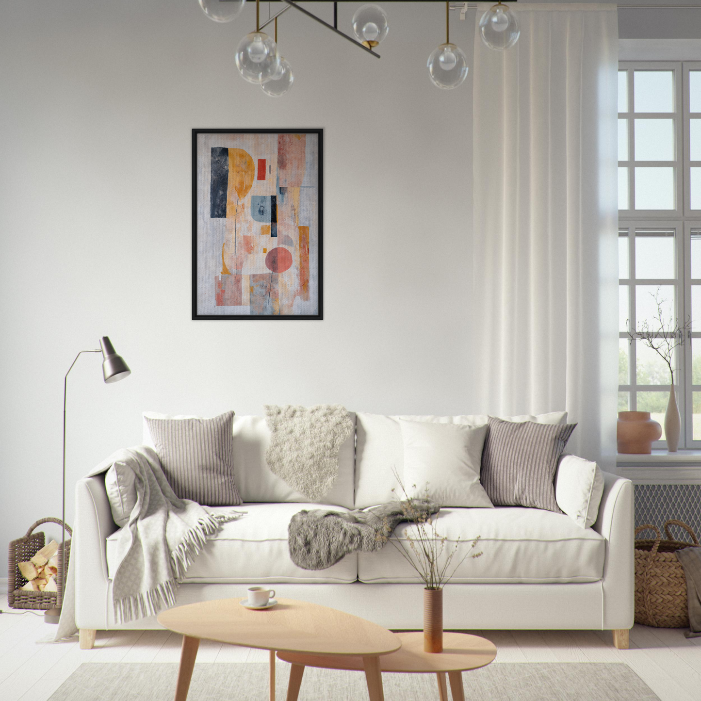 White sofa adorned with throw pillows and blankets from Pink Geometric Reverie collection